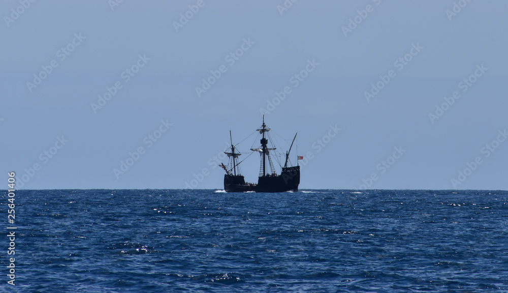 Pirate ship winds the foams in Atlantic Ocean waters