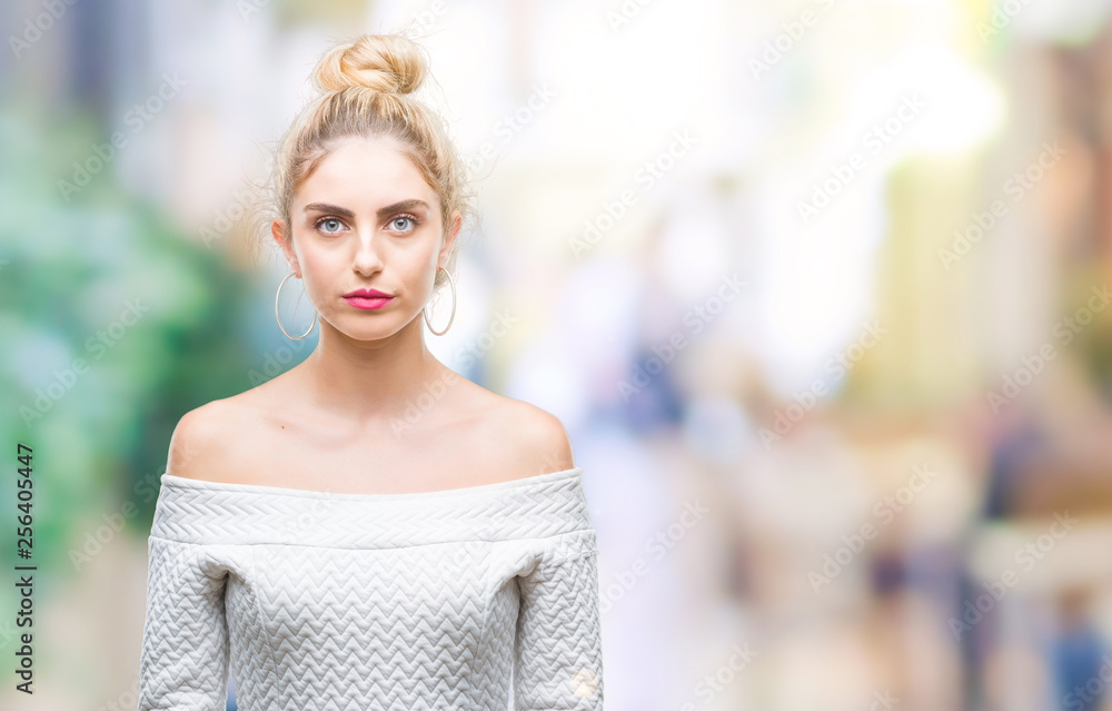Young beautiful blonde and blue eyes woman over isolated background with serious expression on face. Simple and natural looking at the camera. - obrazy, fototapety, plakaty 