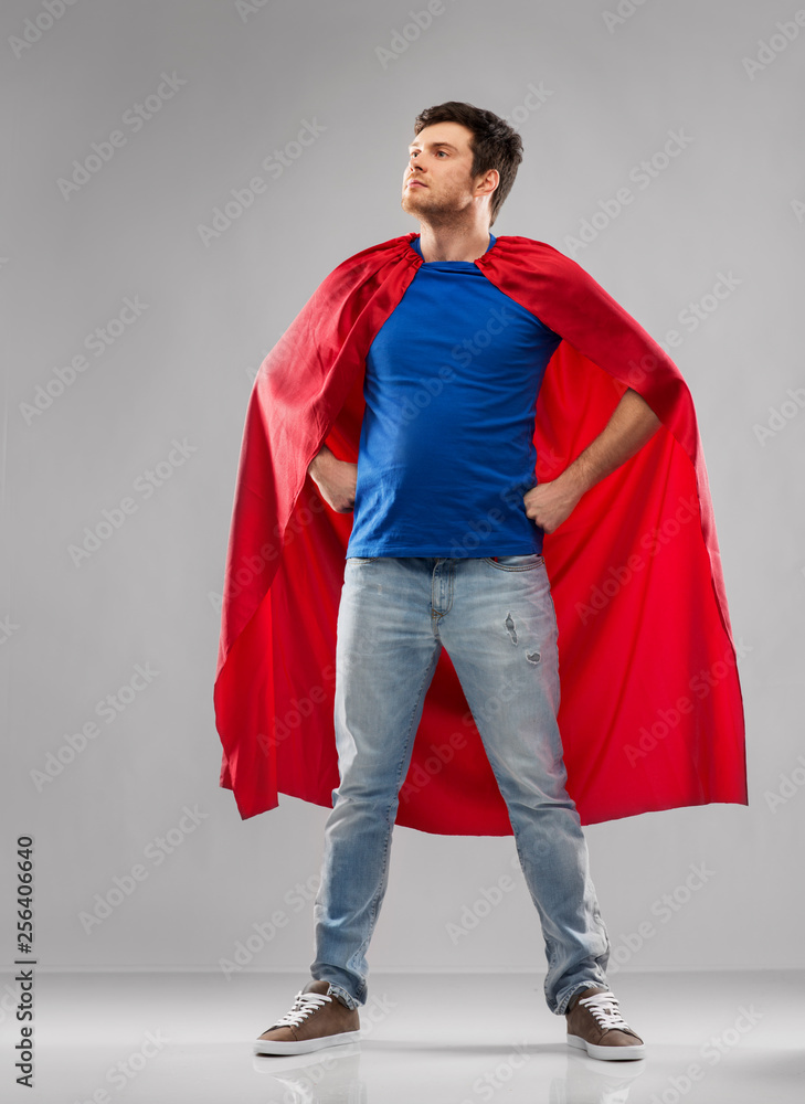 super power and people concept - happy young man in red superhero cape over  grey background Stock Photo | Adobe Stock