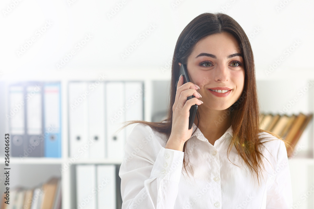Beautiful brunette smiling businesswoman talk cellphone Beautiful brunette smiling businesswoman talk cellphone