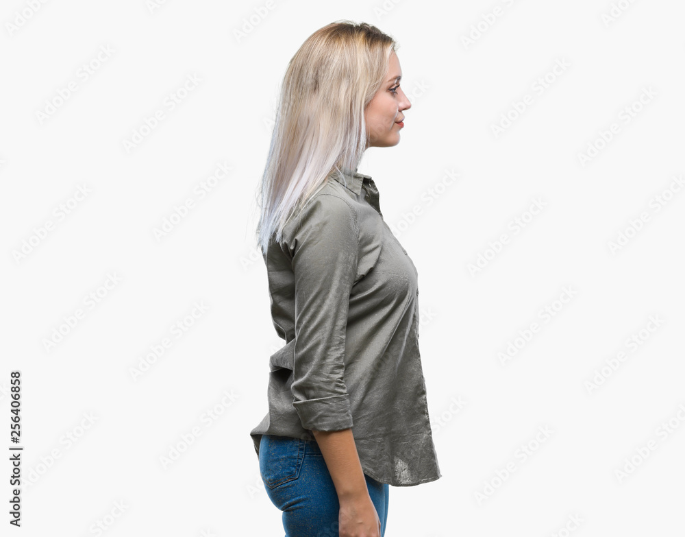 Young blonde business woman over isolated background looking to side, relax profile pose with natural face with confident smile. Young blonde business woman over isolated background looking to side, relax profile pose with natural face with confident smile.