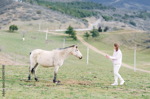 Girl traveler blogger on beautiful views of Georgia. Nature and travel in the mountains.