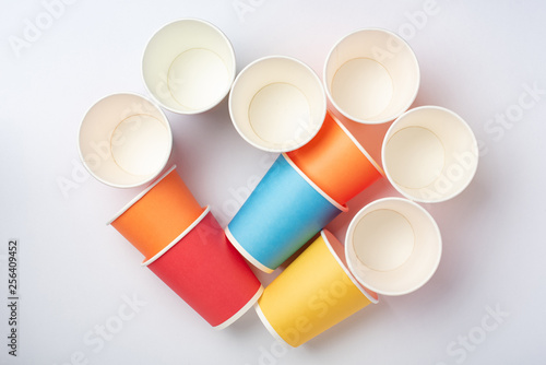 Multicolored eco paper party cups on white background