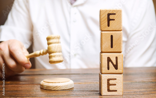 Photography Wooden blocks with the word Fine and judge