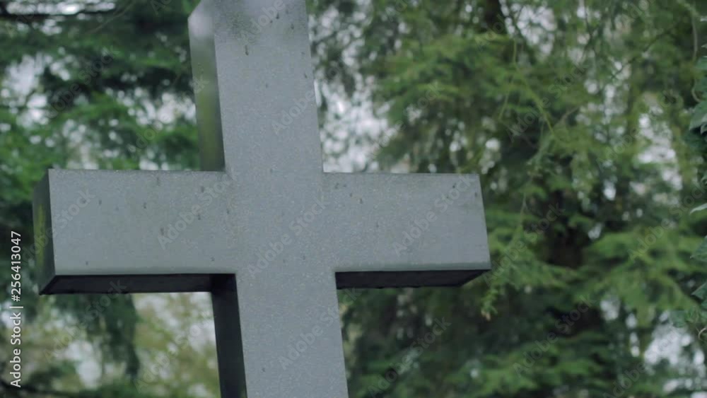 Cross and Tombstone in Green Graveyard Cross and Tombstone in Green Graveyard