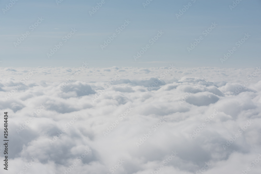 cloud and sky view from the window of an airplane