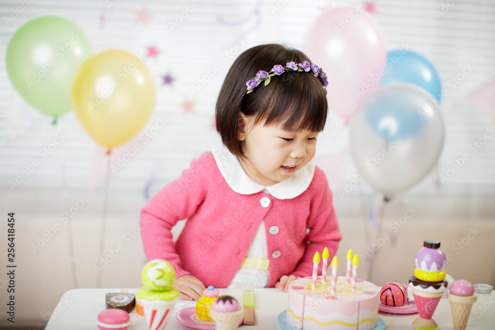 toddler girl celebrating her third birthday at home toddler girl celebrating her third birthday at home