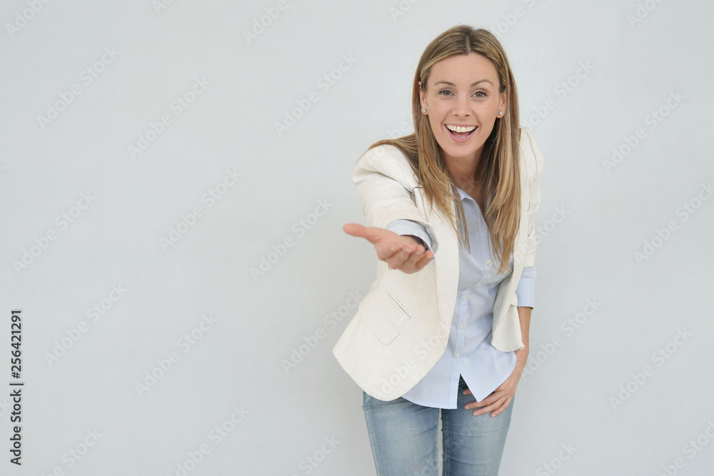 Dynamic businesswoman looking at camera on grey background Dynamic businesswoman looking at camera on grey background