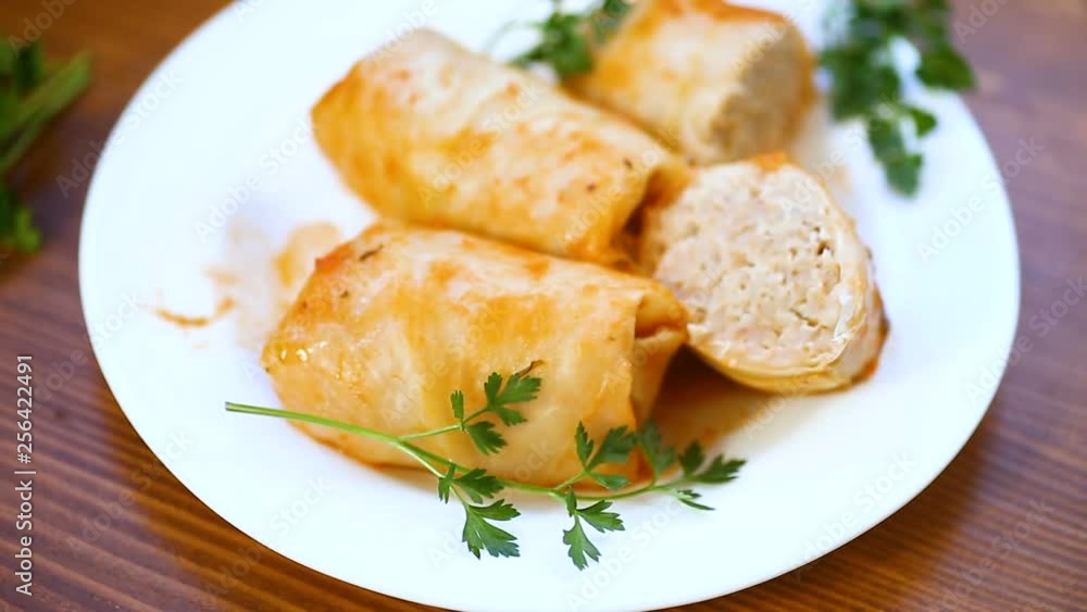 Stuffed cabbage leaves with minced meat and rice in tomato sauce. Stuffed cabbage leaves with minced meat and rice in tomato sauce.