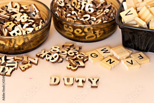forming duty text  with wooden letters 