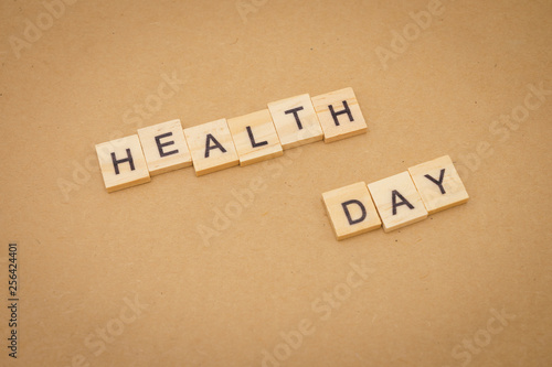 Wood word Health Day using as background Universal day concept and Health Day concept with copy space for your text or design.