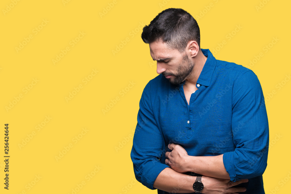 Young handsome man over isolated background with hand on stomach because nausea, painful disease feeling unwell. Ache concept. Young handsome man over isolated background with hand on stomach because nausea, painful disease feeling unwell. Ache concept.