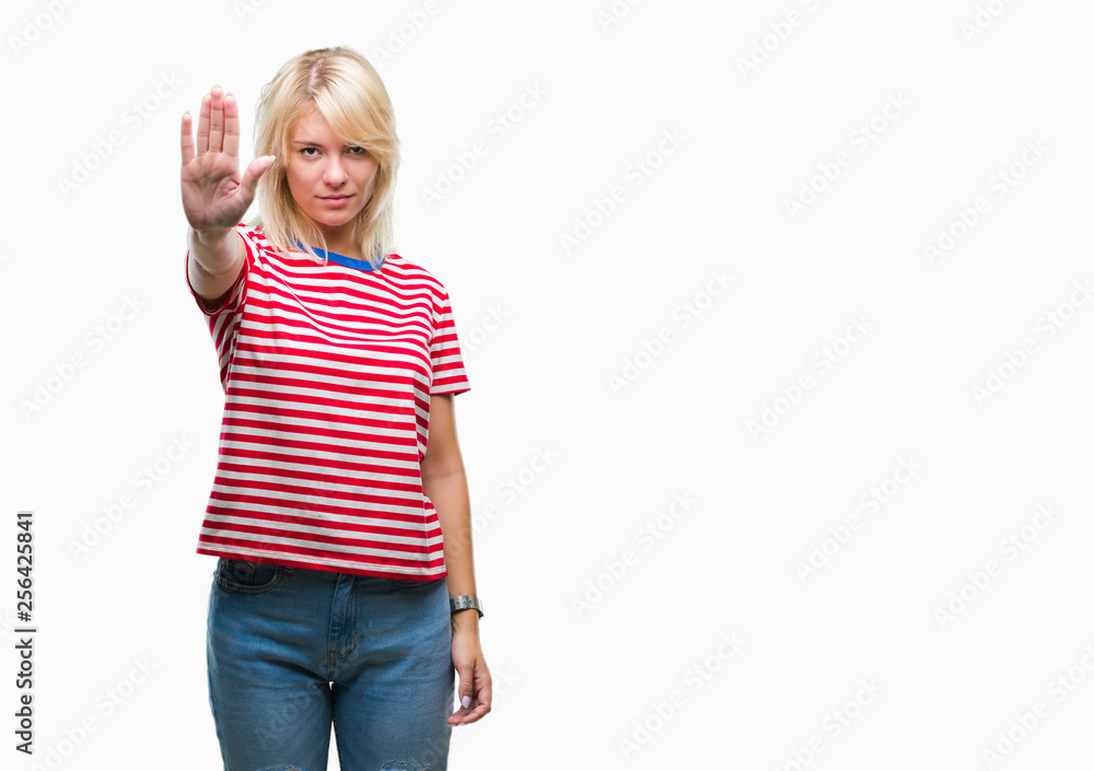Young beautiful blonde woman over isolated background doing stop sing with palm of the hand. Warning expression with negative and serious gesture on the face. Young beautiful blonde woman over isolated background doing stop sing with palm of the hand. Warning expression with negative and serious gesture on the face.