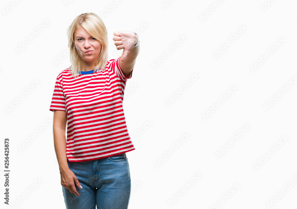 Young beautiful blonde woman over isolated background looking unhappy and angry showing rejection and negative with thumbs down gesture. Bad expression. Young beautiful blonde woman over isolated background looking unhappy and angry showing rejection and negative with thumbs down gesture. Bad expression.
