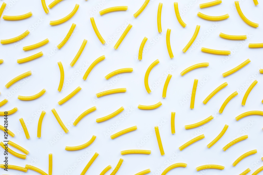Fototapeta premium Uncooked macaroni on a white background.