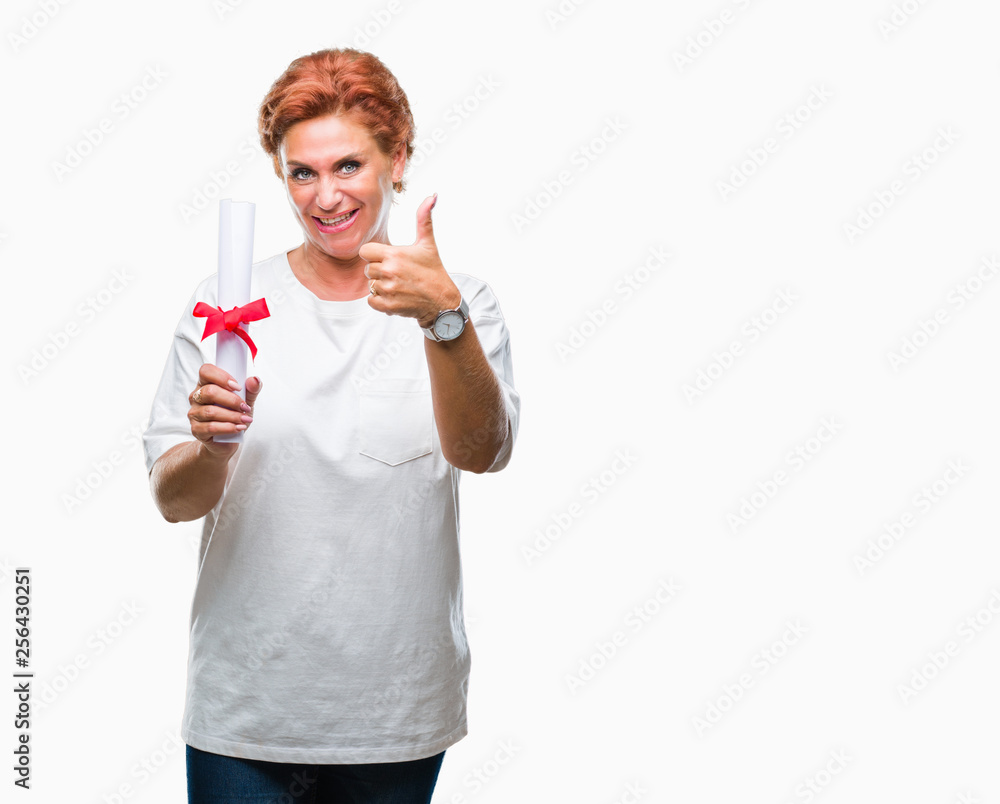 Senior caucasian woman holding degree certificate over isolated background happy with big smile doing ok sign, thumb up with fingers, excellent sign Senior caucasian woman holding degree certificate over isolated background happy with big smile doing ok sign, thumb up with fingers, excellent sign