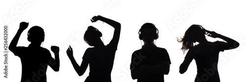 silhouette of figures of a couple of teenagers in headphones listening to music, the guy and the girl are dancing with hands up, the concept of a party and relaxing on a white isolated background