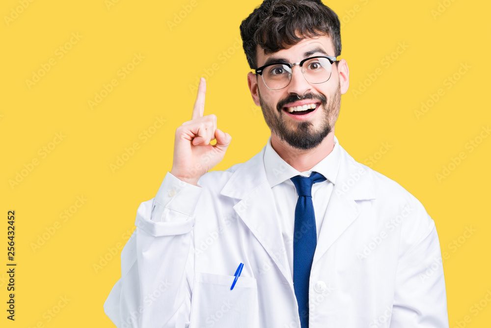 Young professional scientist man wearing white coat over isolated background pointing finger up with successful idea. Exited and happy. Number one. Young professional scientist man wearing white coat over isolated background pointing finger up with successful idea. Exited and happy. Number one.
