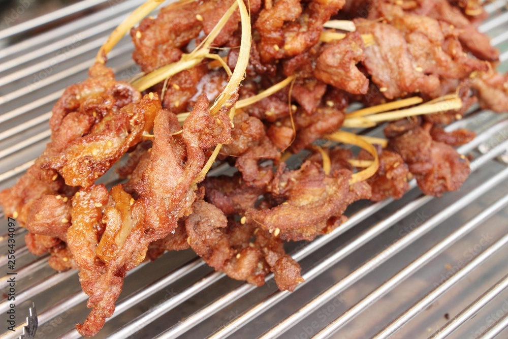 Fried sun dried pork at street food Fried sun dried pork at street food