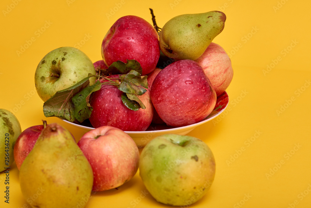 Fresh ripe pears and apples with leaves Fresh ripe pears and apples with leaves