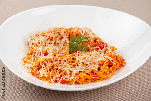 pasta with cheese in a white plate