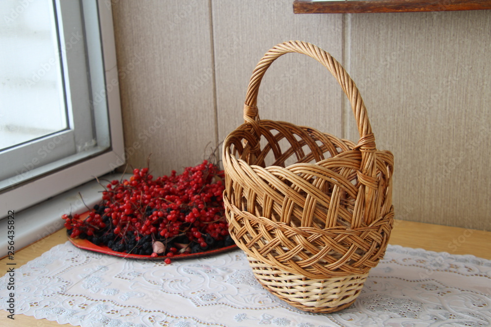 wicker basket and viburnum berries wicker basket and viburnum berries