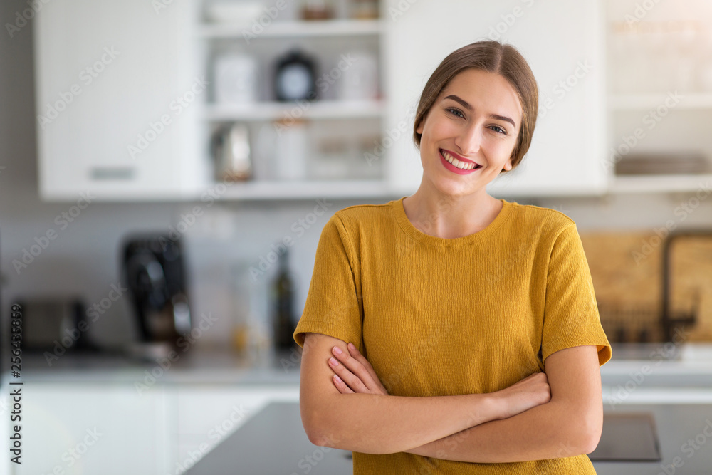 Young woman standing in the kitchen Young woman standing in the kitchen