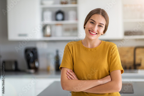 Young woman standing in the kitchen