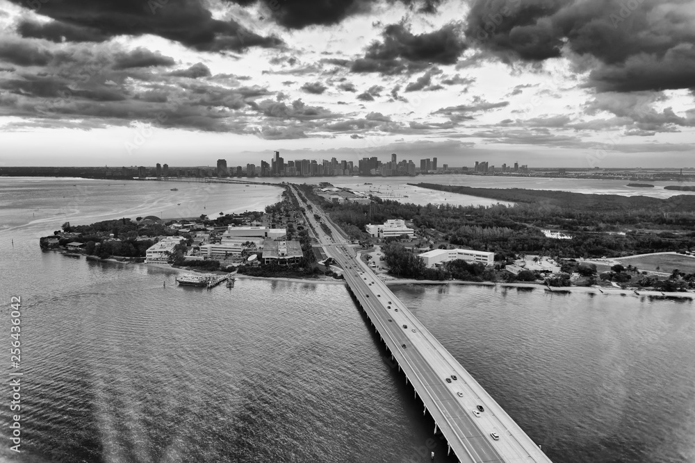 Virginia Key, Rickenbacker Causeway and Downtown Miami skyline. Aerial view from helicopter at sunset
