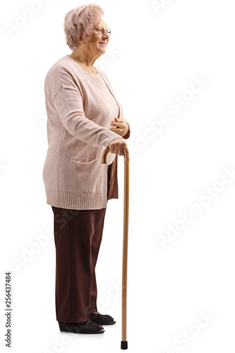 Принти на полотні Old lady with a cane standing