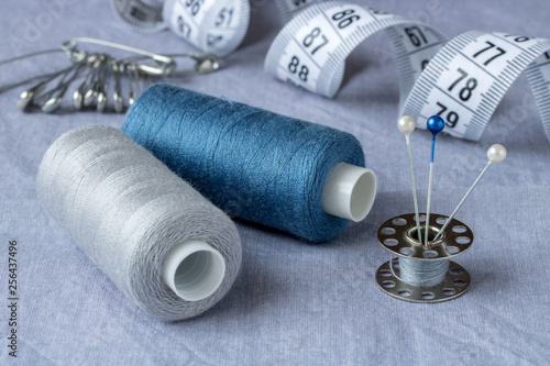 Sewing accessories and accessories for needlework in gray-blue shades.
