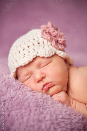 Newborn Baby Girl Sleeping Peacefully in Knit Hat - Infant Portrait