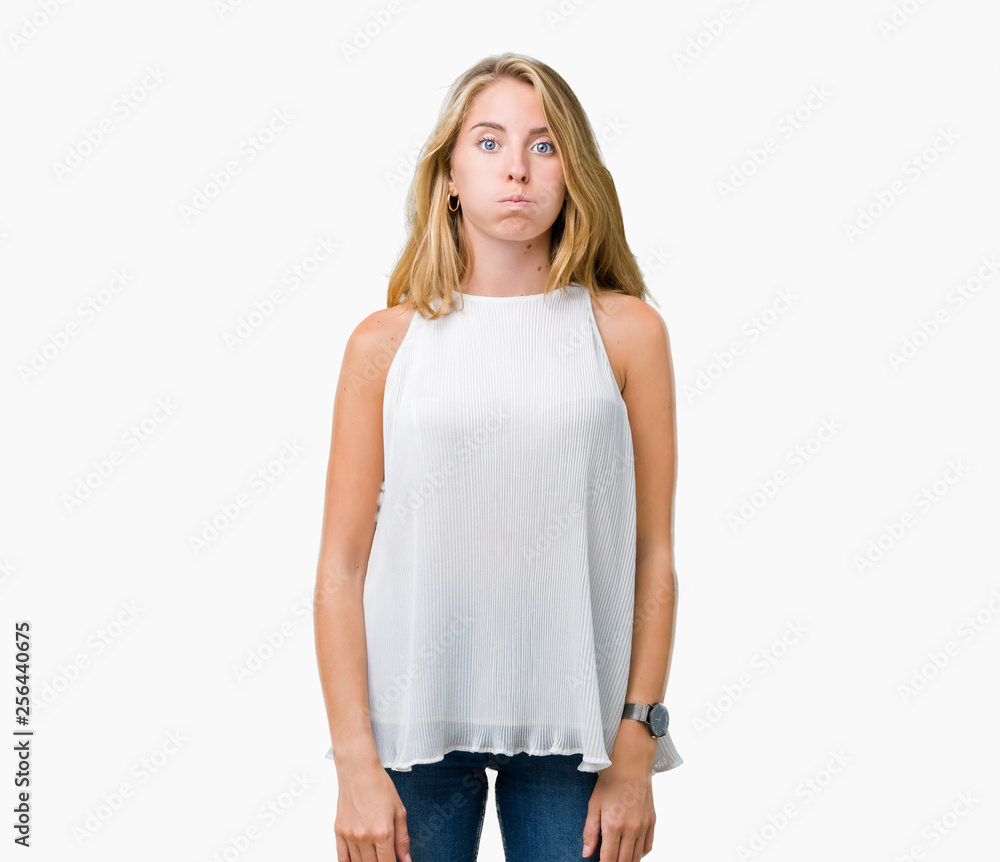 Fototapeta premium Beautiful young elegant woman over isolated background puffing cheeks with funny face. Mouth inflated with air, crazy expression.