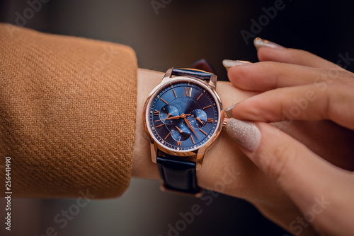 Stylish blue watch on woman hand