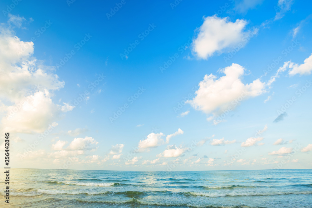 Beautiful early morning sunrise over the sea the horizon,blue sky background texture with white clouds sunset.