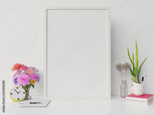 Fototapeta Naklejka Na Ścianę i Meble -  Poster mockup with vertical frame and right/left have book,flower white wall background,3D rendering