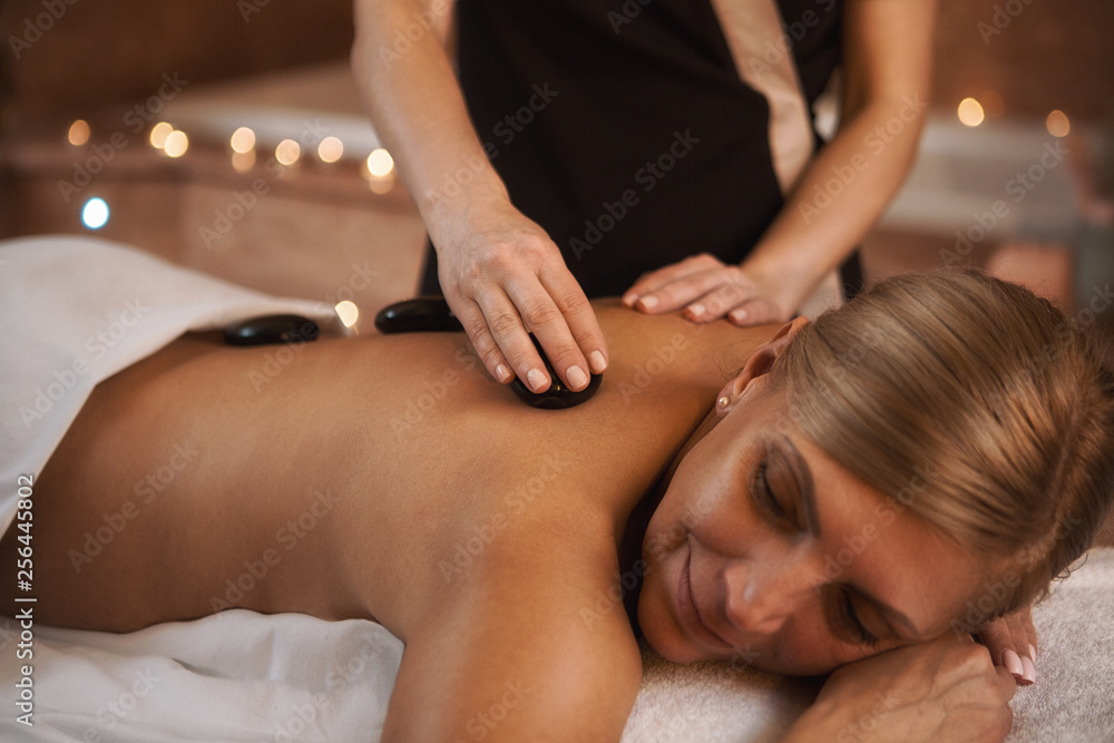 Fototapeta premium Mature woman getting massage at the spa