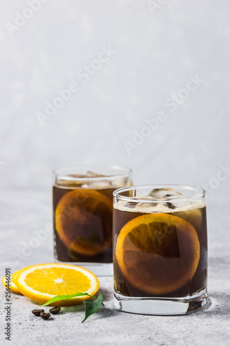 Orange spiced iced coffee. Selective focus, space for text.