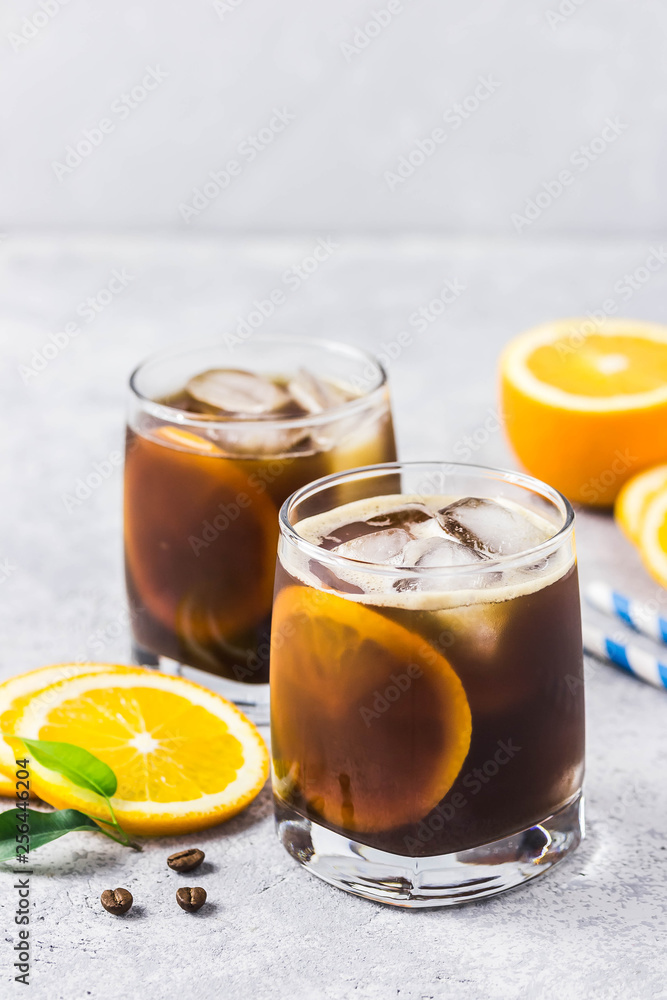 Orange spiced cold brew coffee. Selective focus, space for text. Orange spiced cold brew coffee. Selective focus, space for text.
