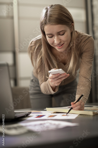 Beautiful young businesswoman working at the office