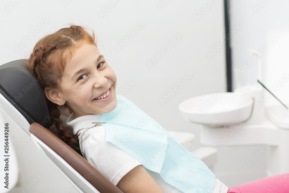 Little girl having her teeth examined by dentist Little girl having her teeth examined by dentist
