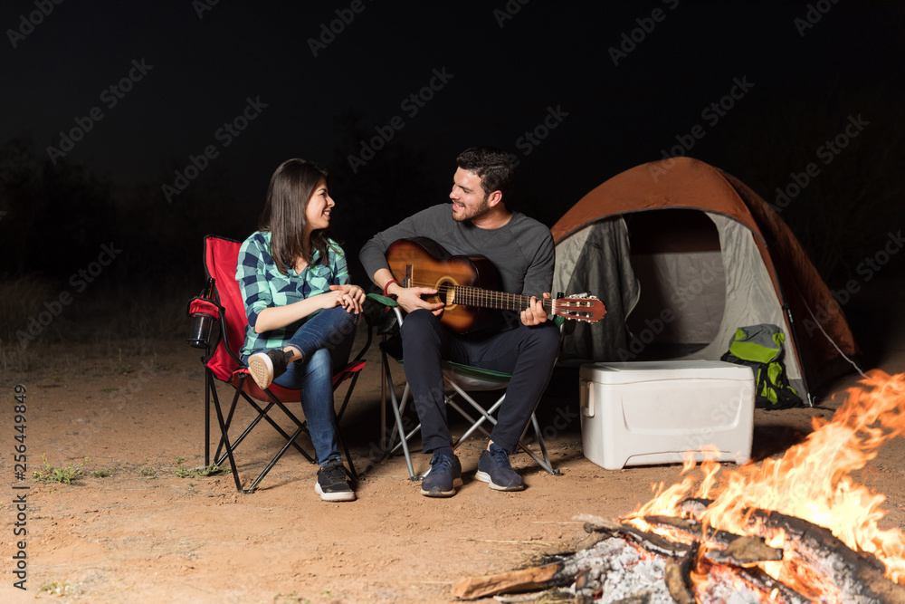 Couple Enjoying Their Date By Campfire