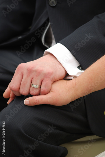 holding hands at the wedding ceremony, together until the