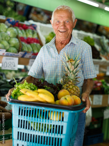 Senior man with basket with fresh greengrocery