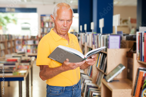 man reading new books