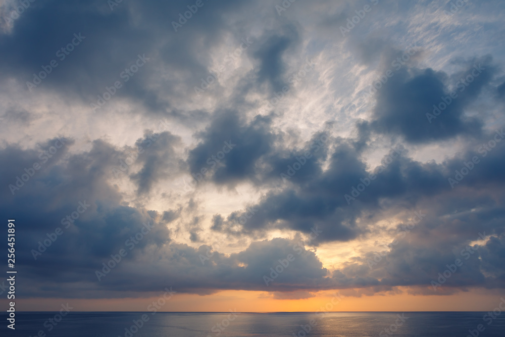 cloudscape above the ocean seascape with reflection