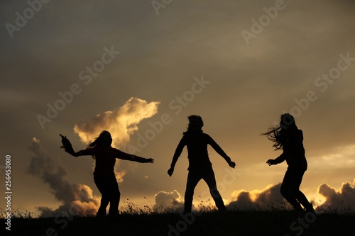 group of happy young people dancing at the beach on beautiful summer sunset .savsat/artvin/turkey