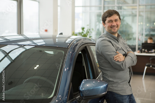 Mature man at the car dealership © Nestor