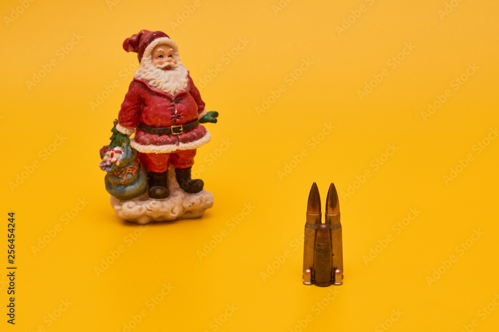 Concept New Year crime. Santa and bullets