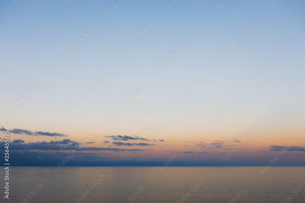 blue sky and ocean at sunset, minimalism background